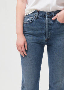 Close-up view of model wearing Agolde 90's Pinch Waist Jeans in Portrait