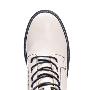 Top-down view of Chinese Laundry Harker Bootie toe: A white, vegan leather lace-up heeled bootie.