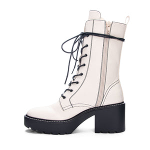 Side view of Chinese Laundry Harker Bootie: A white, vegan leather lace-up heeled bootie.