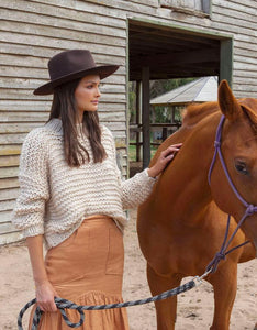 Model wearing Ace of Something Bonanza fedora in Redwood