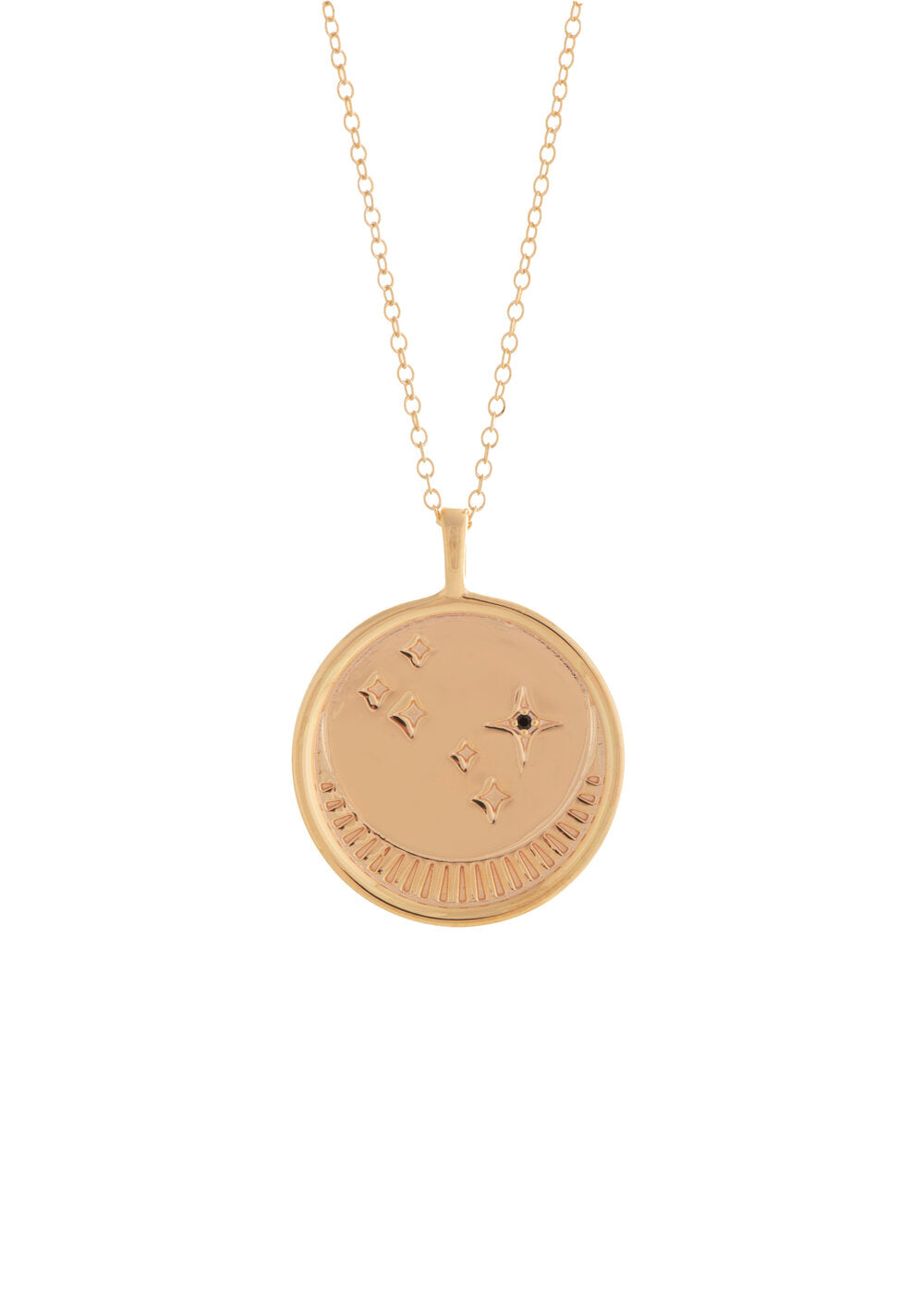 UNIKONCEPT Lifestyle boutique: image shows the Franz Necklace in gold rose quartz by Sarah Mulder. This necklace features a circular pendant engraved with a moon and star details as well as a small rose quartz stone. The pendant hangs from a delicate gold chain.