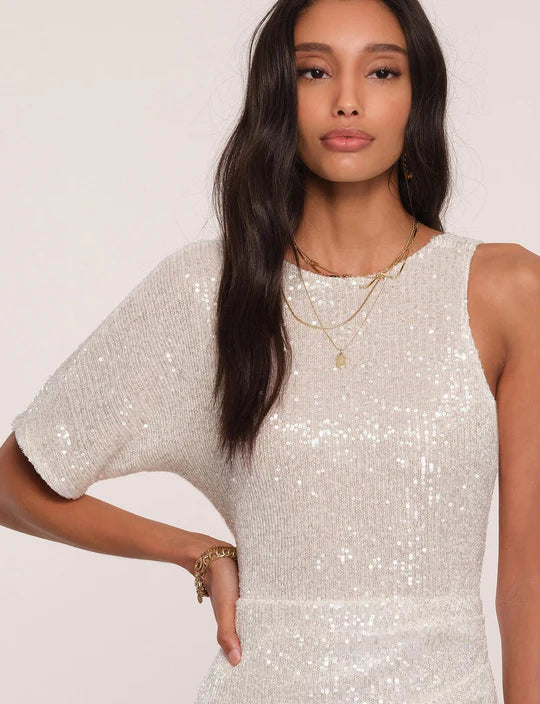 UNIKONCEPT Lifestyle Boutique and Lounge; Close-up view of model wearing Heartloom Pomelo Dress in the colour "Ice": A white sequinned one-sleeve cocktail dress.