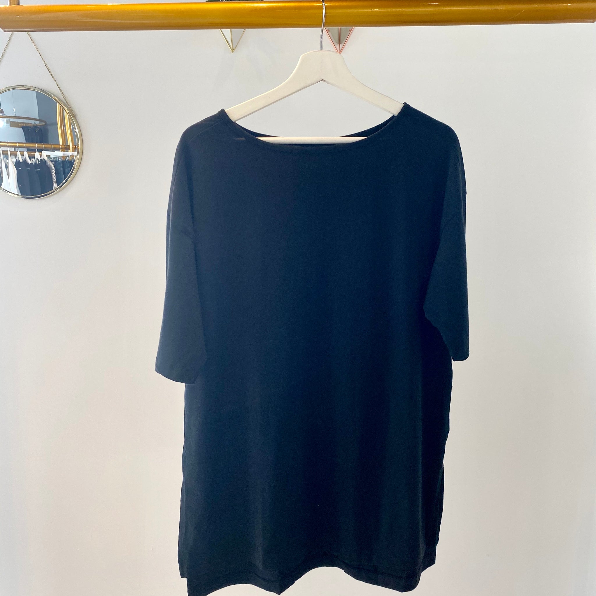 UNIKONCEPT Shoppe & Lounge: This black tunic crew neck by KOTN is buttery soft. It is made from 100% Egyptian Cotton. It is a straight cut with side slits.