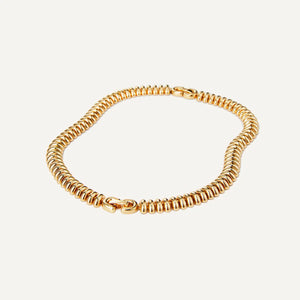 Jenny Bird Sofia Choker in High Polish Gold fastened on a white background