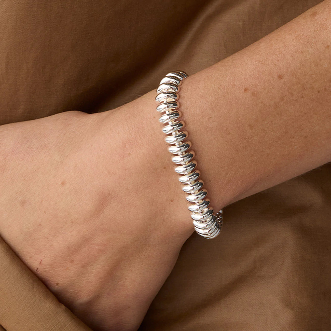 Close-up view of model wearing Jenny Bird Sofia Bracelet in High Polish Silver