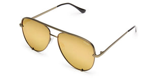 Image shows a pair of Quay Australia sunglasses. The High key sunglasses by Design Perkins are an aviator style of sunnies the styles available include a silver frame with a light grey lens and a gold frame with a green/gold polarized lens.