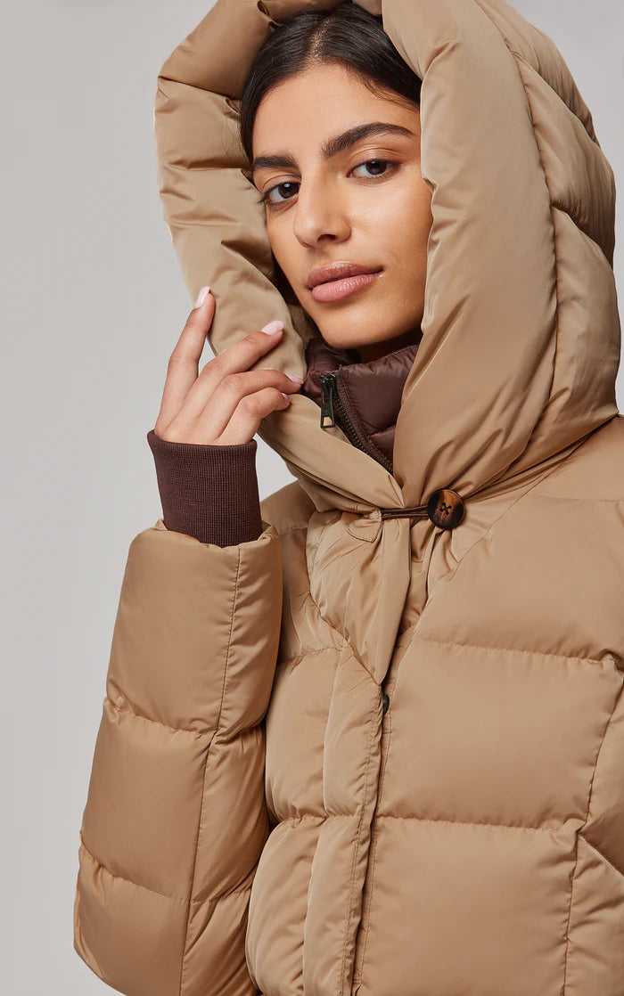 UNIKONCEPT Lifestyle Boutique and Lounge; Soia and Kyo Sonny Coat in Toffee - tan coloured long down-filled puffer jacket with windbreaker and large hood. Close up on model wearing hood