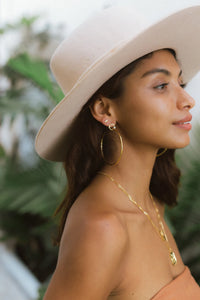 UNIKONCEPT Lifestyle Boutique and Lounge; Alternate view of Model wearing the Miley Large Hoops by Sarah Mulder in Gold Rose Quartz
