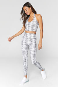 UNIKONCEPT Lifestyle boutique: Image shows the essential HW leggings by Spiritual Gangster. These ultra flattering highwaisted leggings come in a grey snake print.