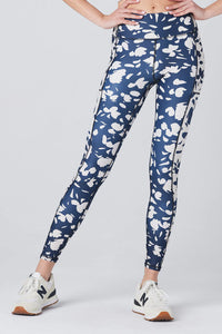 UNIKONCEPT Lifestyle Boutique and Lounge; Model wearing the Dynamic Pant in Indigo by Saltwater Luxe - a navy blue and cream abstract floral athletic legging.