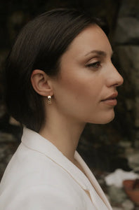 UNIKONCEPT Lifestyle Boutique and Lounge; Sarah Mulder Monty Demi Hoop Earrings in Gold Cubic Zirconia pictured on a model
