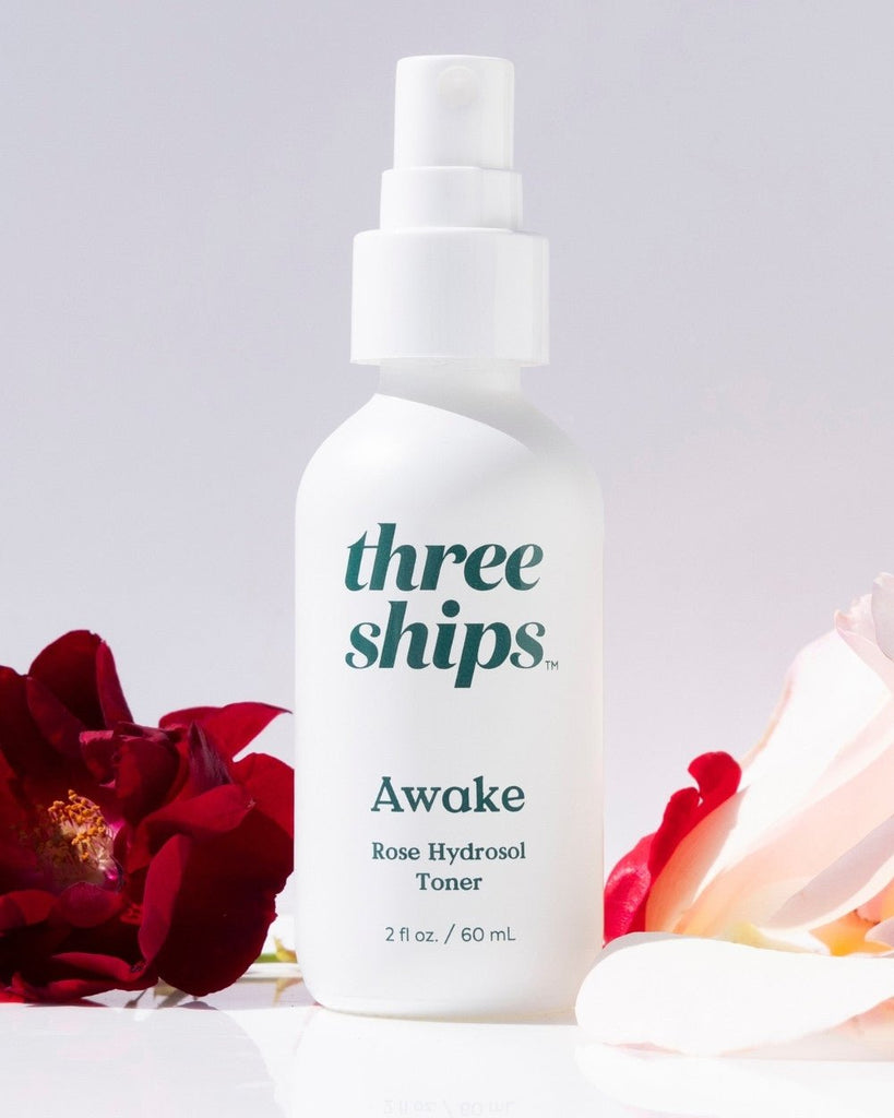Three Ships Awake Rose Hydrosol Toner pictured on a white background with floral decor