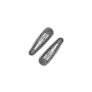 UNIKONCEPT Lifestyle Boutique and Lounge; Kitsch Rhinestone Snap Clips pictured on a white background. Rhinestone studded snap hair clips
