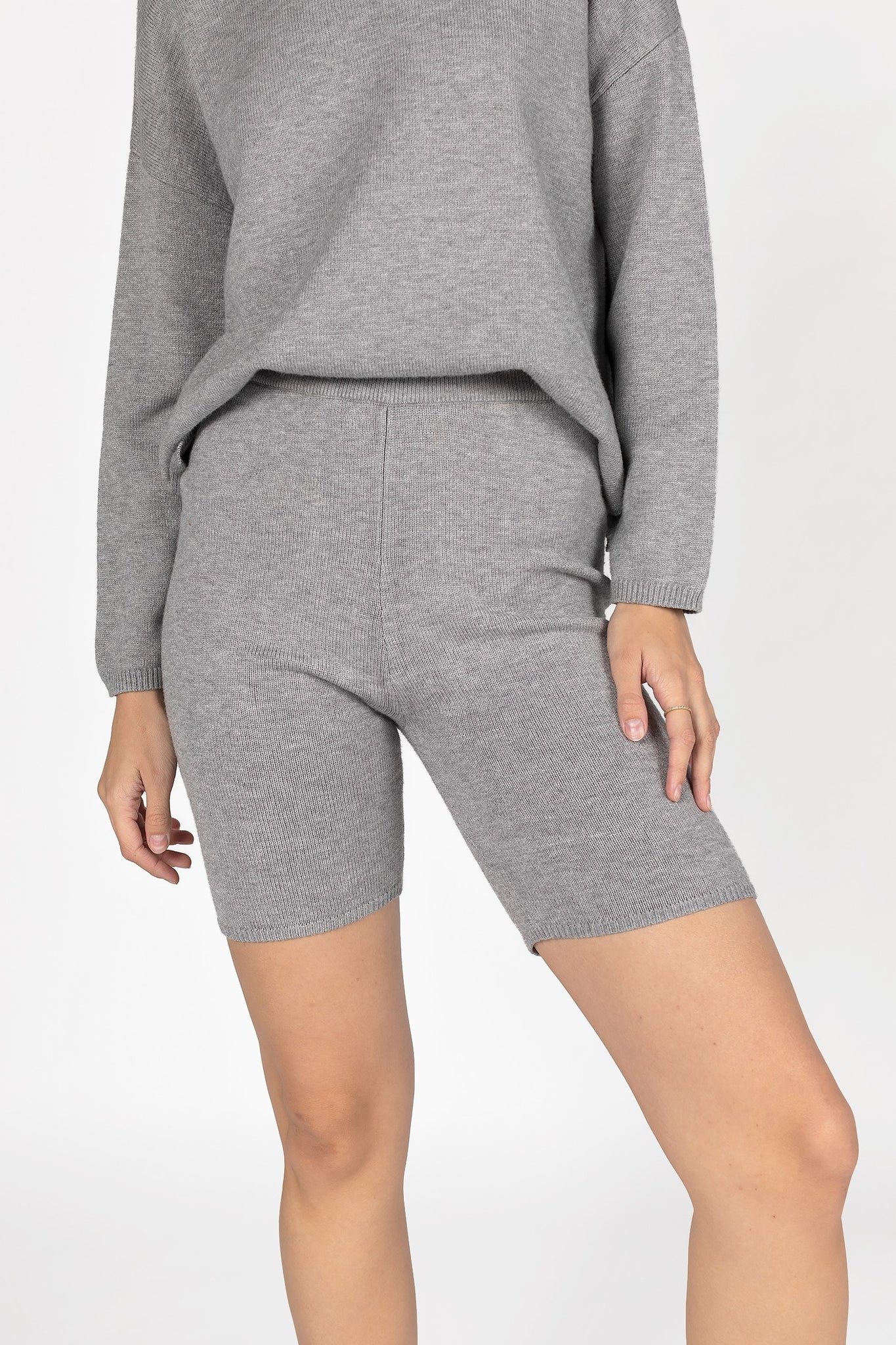 UNIKONCEPT Lifestyle Boutique and Lounge; Mod Ref Birdie Knit Bike Shorts. Grey knit mid-thigh bike shorts pictured on a model
