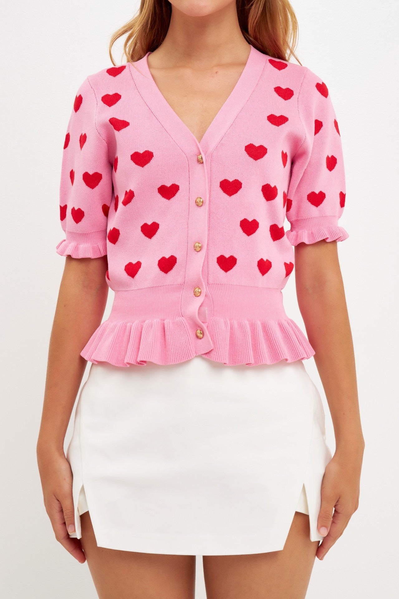 Close-up view of Corazon Peplum Cardi by English Factory in Pink