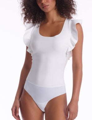 Model wearing Neoprene Ruffle Bodysuit in White from Commando with Ruffle detailing at the shoulders available at UniKoncept in Waterloo
