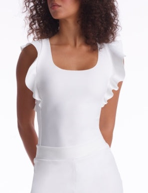 Model wearing Neoprene Ruffle Bodysuit in White from Commando with Ruffle detailing at the shoulders available at UniKoncept in Waterloo